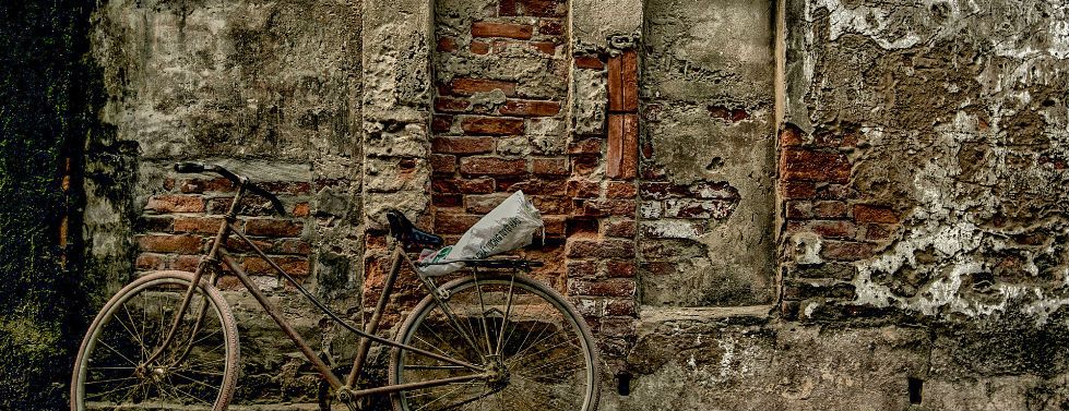 Bicycle against a brick wall